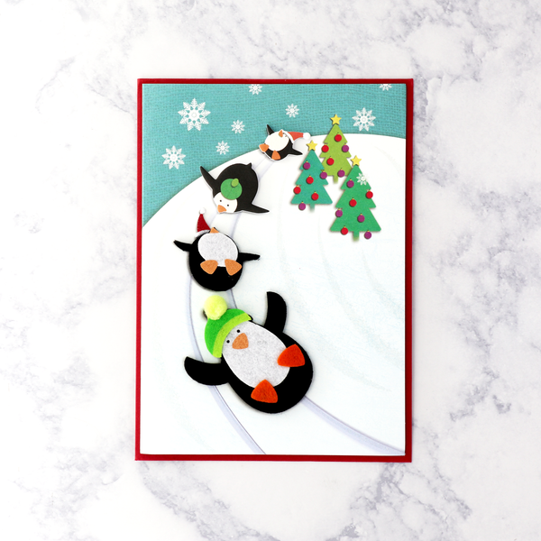 Sledding Penguins "Seasons Of Merry" Christmas Card